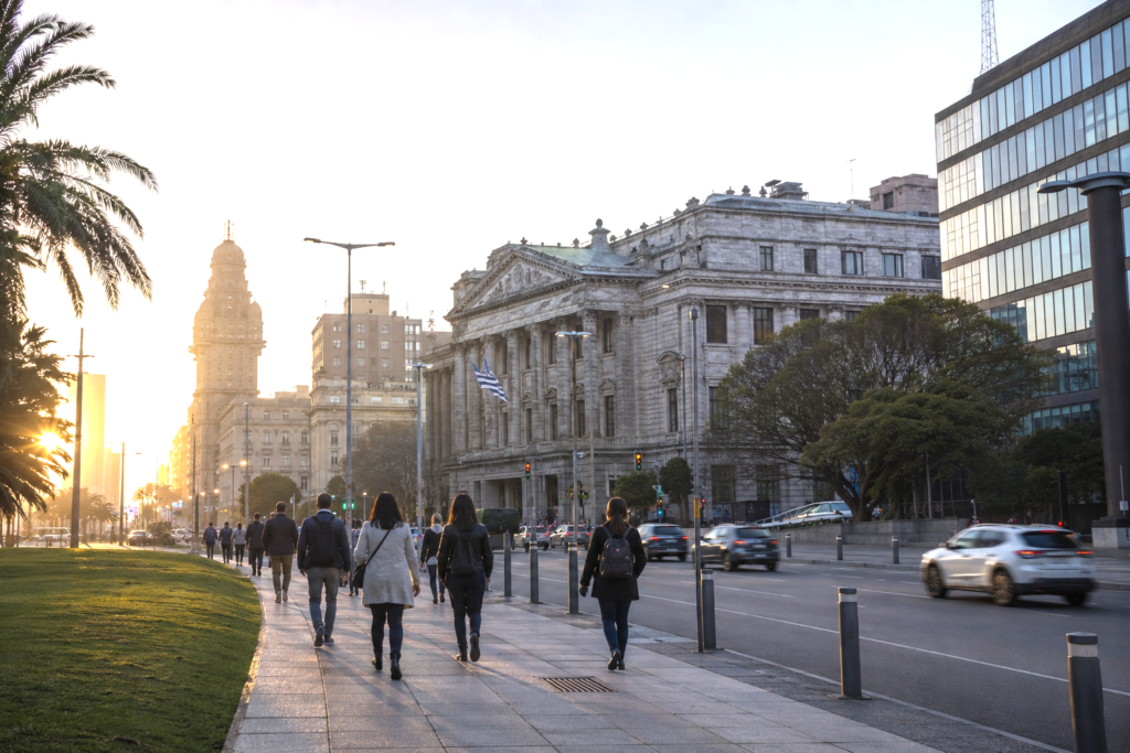 Realistic editorial photograph of Montevideo symbolizing institutional reform, economic modernization and social cohesion.