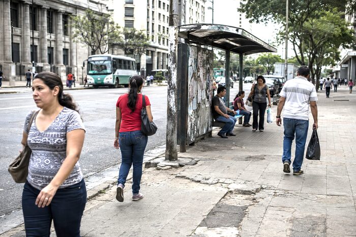 Citizens walking through an urban environment reflecting the consequences of weak institutional governance.